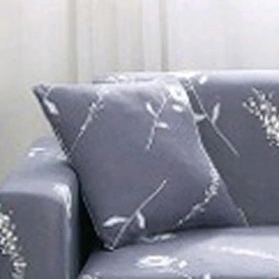 Stretchable geometric print sofa cover on a three-seater sofa