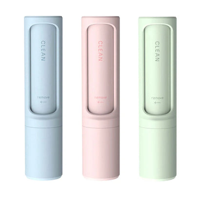 Rotating cylinder electrostatic pet hair remover brush in white, blue, green, and pink