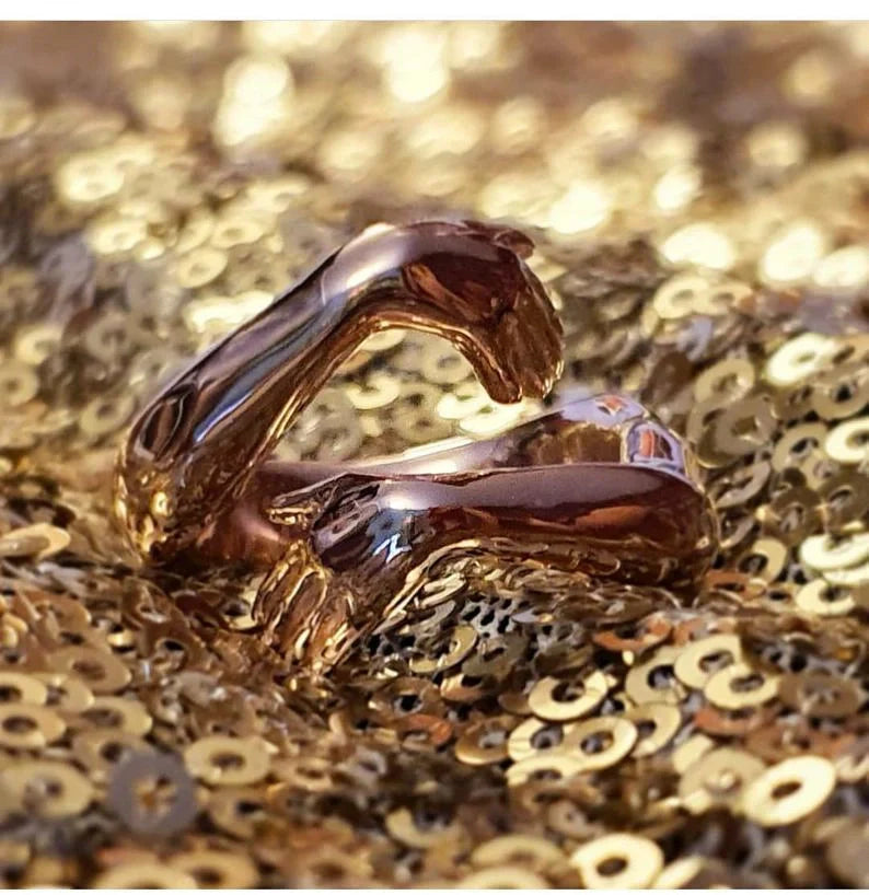 Elegant Adjustable Love Hands Embracing Ring in gold and silver, a perfect symbol of affection