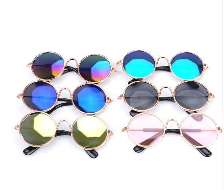 Stylish pet sunglasses in various colors, including khaki, pink, green, and yellow