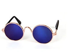 Stylish pet sunglasses in various colors, including khaki, pink, green, and yellow