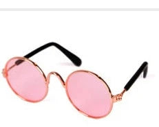 Stylish pet sunglasses in various colors, including khaki, pink, green, and yellow