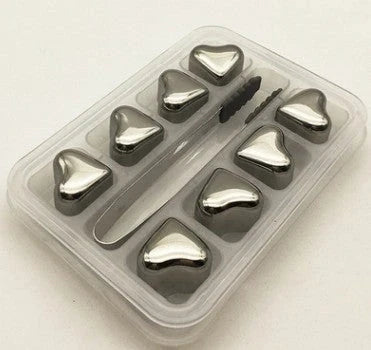 Premium stainless steel whisky chilling stones set in various shapes and sizes, including square, circular, heart, and diamond-shaped stones