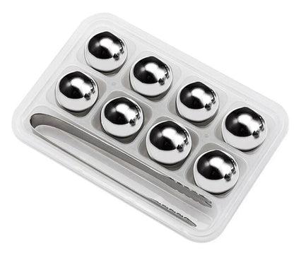 Premium stainless steel whisky chilling stones set in various shapes and sizes, including square, circular, heart, and diamond-shaped stones
