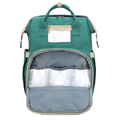 Portable folding crib and mummy bag in green and grey, compact design for baby travel