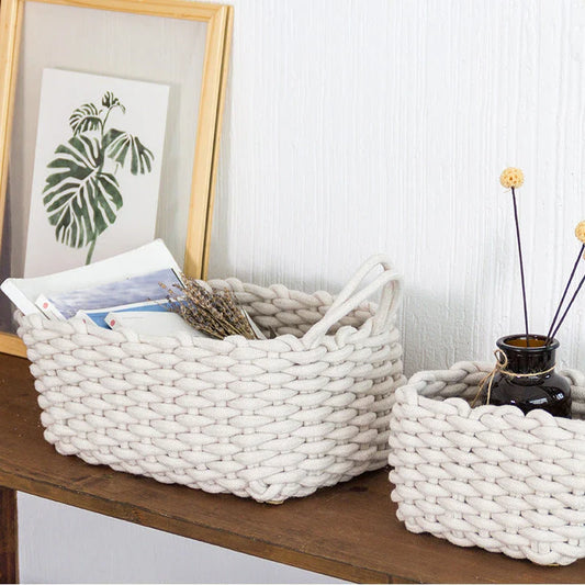 Hand-woven cotton rope storage basket in grey and white colours, featuring a minimalist nordic design for practical and stylish home organisation