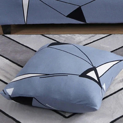 Stretchable geometric print sofa cover on a three-seater sofa