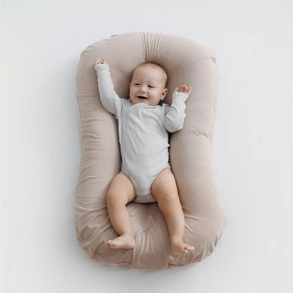 Portable baby nest crib with cotton cover for newborns, dimensions 75cm by 45cm