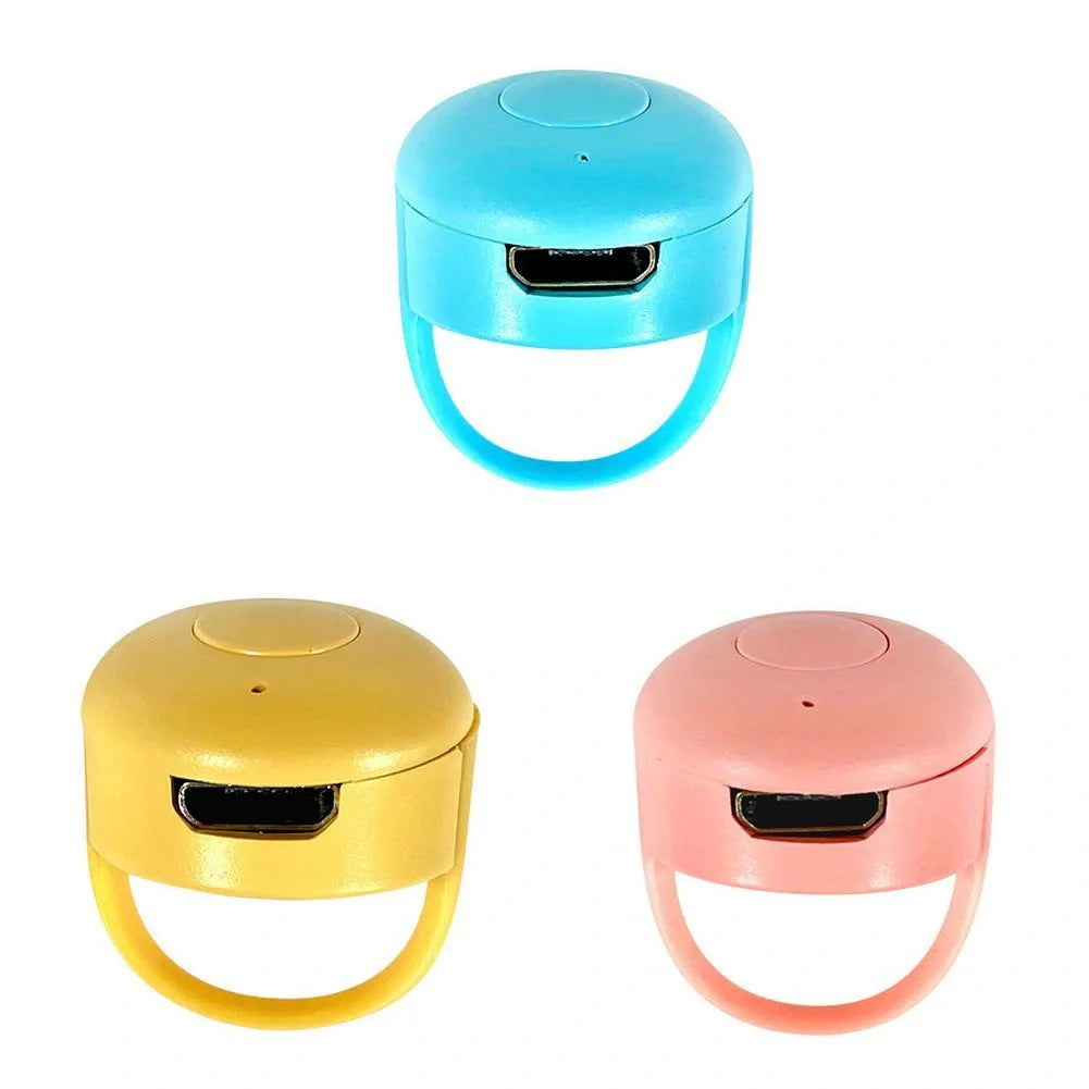Bluetooth remote control ring for mobile phones in yellow, blue, or pink