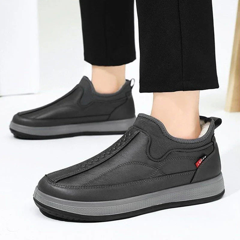 Cozy winter snow boots with round-toe design, non-slip platform, and warm fleece lining in black and grey colors
