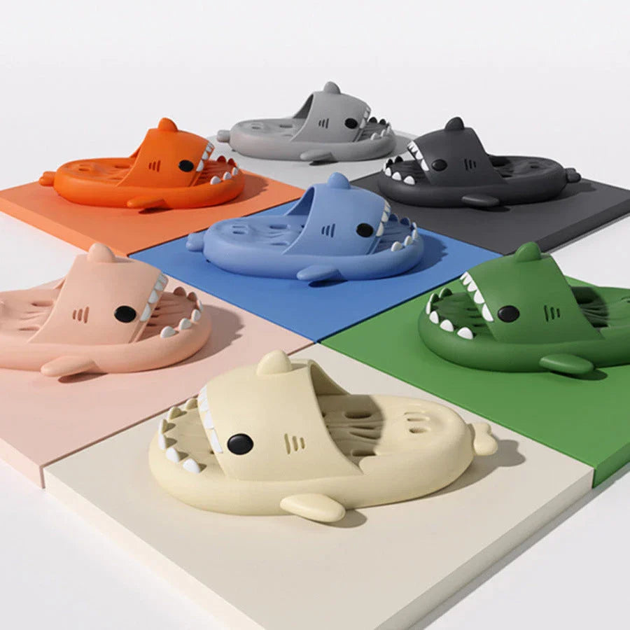 Fashionable shark-themed shower slides with drainage holes, featuring a realistic shark design, quick-drying EVA material, and non-slip traction.