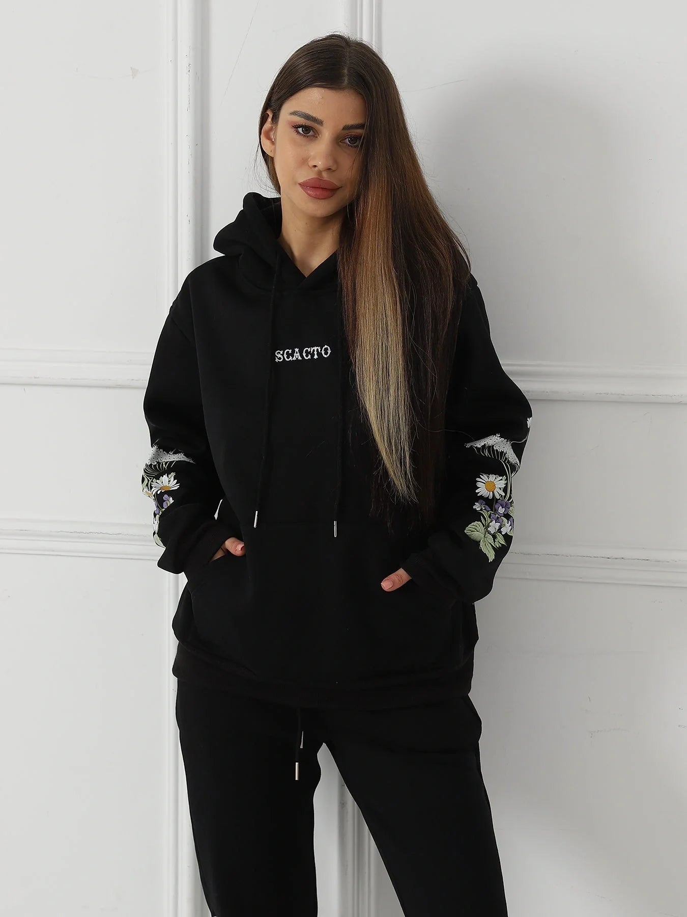 Women's floral long sleeved sweatshirt in black, blue, and apricot