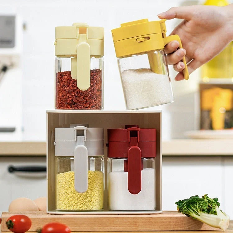 Small glass seasoning jars with lids and built-in spoons for easy measuring and storage