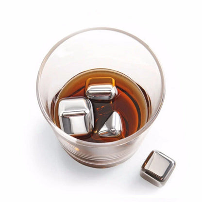 Premium stainless steel whisky chilling stones set in various shapes and sizes, including square, circular, heart, and diamond-shaped stones
