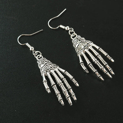 Elegant vintage carved skull and skeleton hands earrings in gold, bronze, and silver finishes