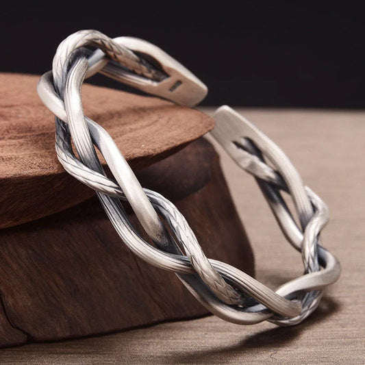 Elegant three-strand sterling silver bracelet with a unique twist design, perfect for couples and everyday wear