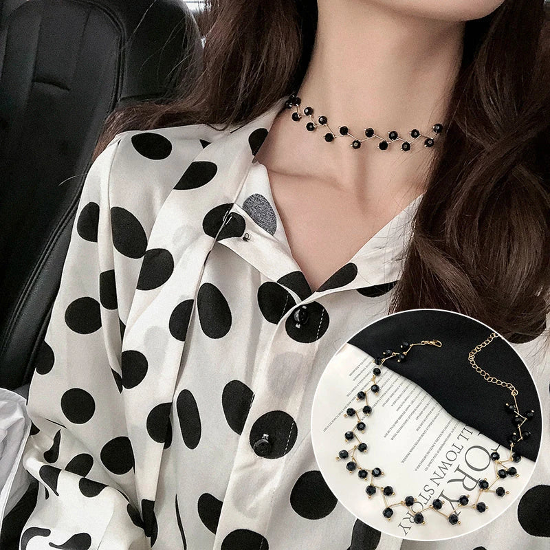 Elegant collection of pearl and crystal necklaces in various styles, including gold, silver, and two-piece sets