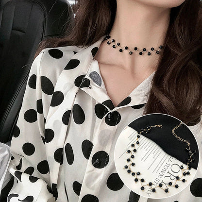 Elegant collection of pearl and crystal necklaces in various styles, including gold, silver, and two-piece sets