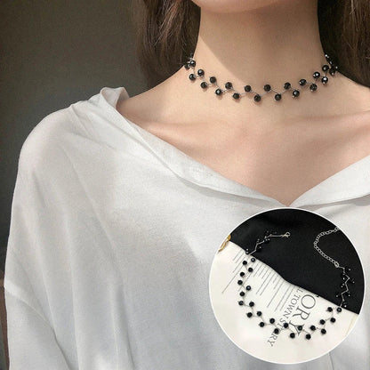 Elegant collection of pearl and crystal necklaces in various styles, including gold, silver, and two-piece sets