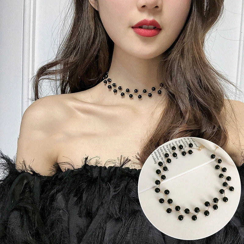 Elegant collection of pearl and crystal necklaces in various styles, including gold, silver, and two-piece sets