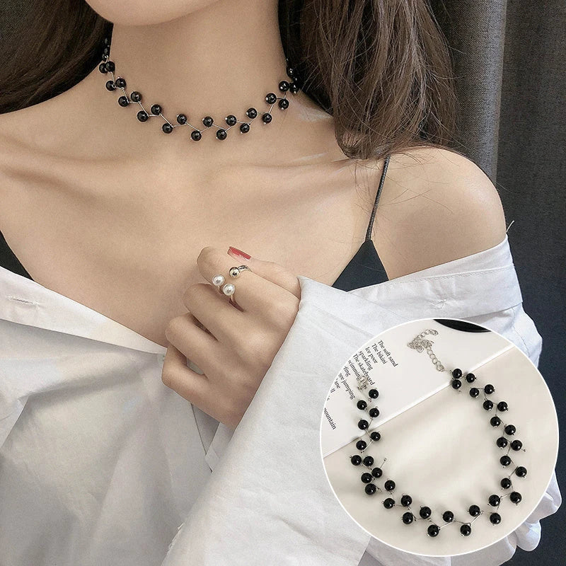 Elegant collection of pearl and crystal necklaces in various styles, including gold, silver, and two-piece sets