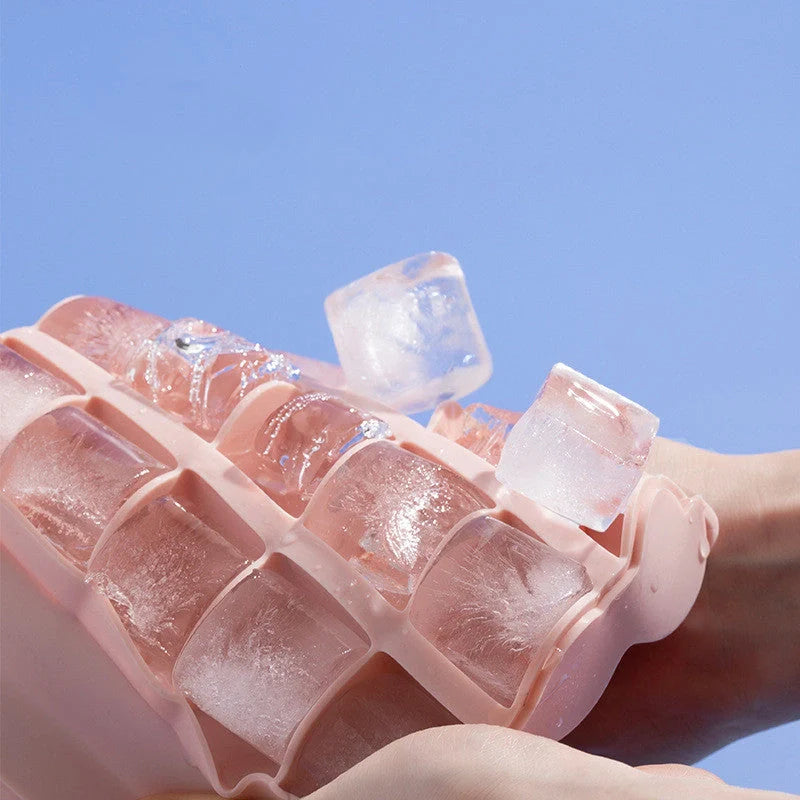 Silicone ice tray for making homemade ice hockey pucks in light blue, pink, and dark blue