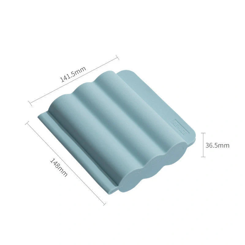Silicone ice tray for making homemade ice hockey pucks in light blue, pink, and dark blue
