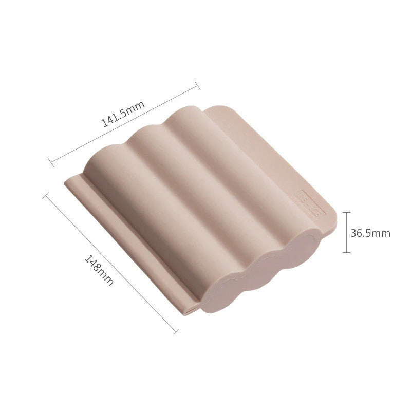Silicone ice tray for making homemade ice hockey pucks in light blue, pink, and dark blue