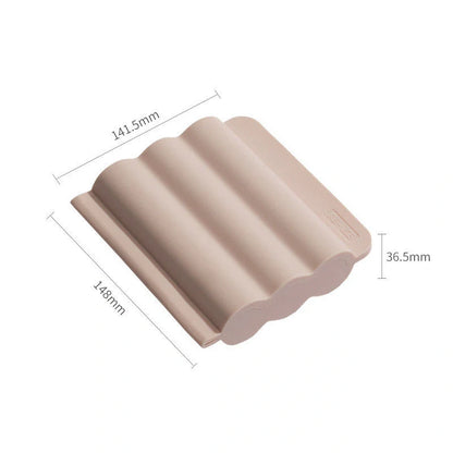 Silicone ice tray for making homemade ice hockey pucks in light blue, pink, and dark blue