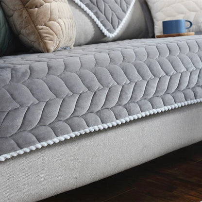 Thick plush quilted sofa cover in various colours on a modular sofa