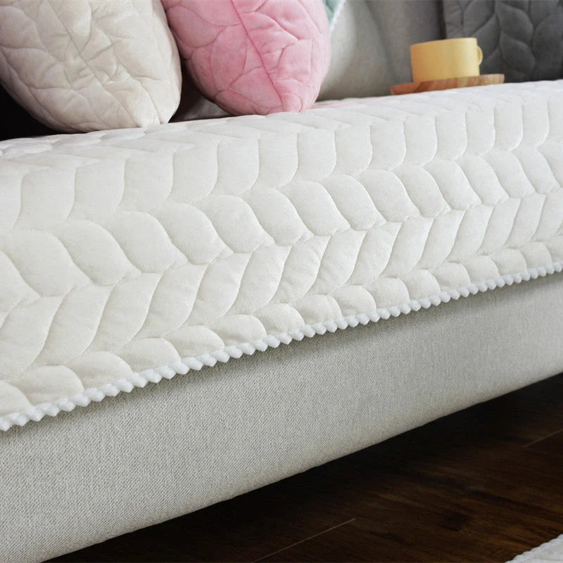 Thick plush quilted sofa cover in various colours on a modular sofa