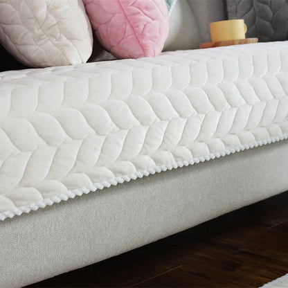 Thick plush quilted sofa cover in various colours on a modular sofa