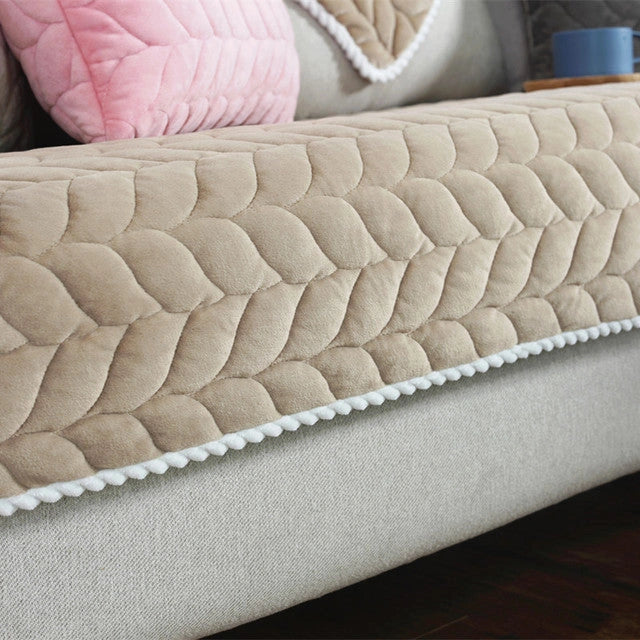 Thick plush quilted sofa cover in various colours on a modular sofa