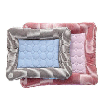 A cooling pet bed made of breathable fabric that provides a refreshing chill for dogs and cats to stay comfortable during hot weather.