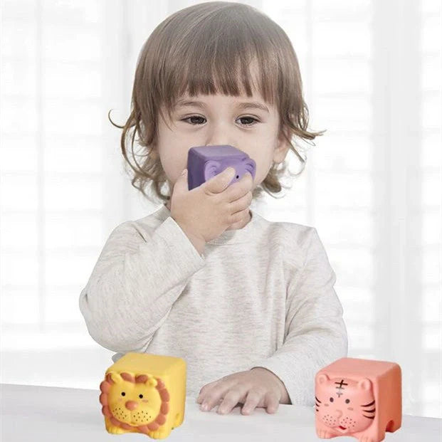 Soft plastic building blocks with animal relief designs for infants and toddlers