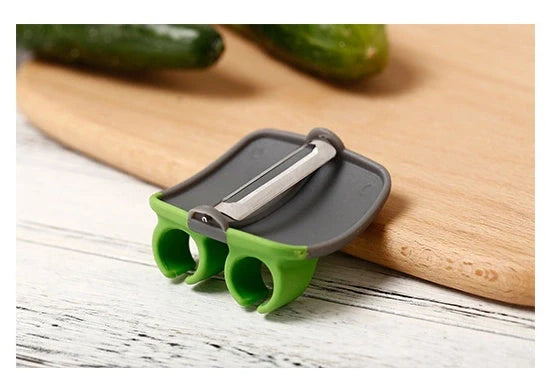 Two-finger peeler with ergonomic grip and stainless steel blade