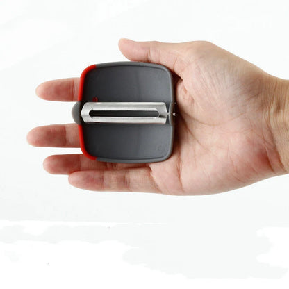 Two-finger peeler with ergonomic grip and stainless steel blade