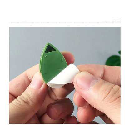 Versatile leaf-shaped plant clips in green, designed to provide discreet and effective support for climbing vines and potted plants