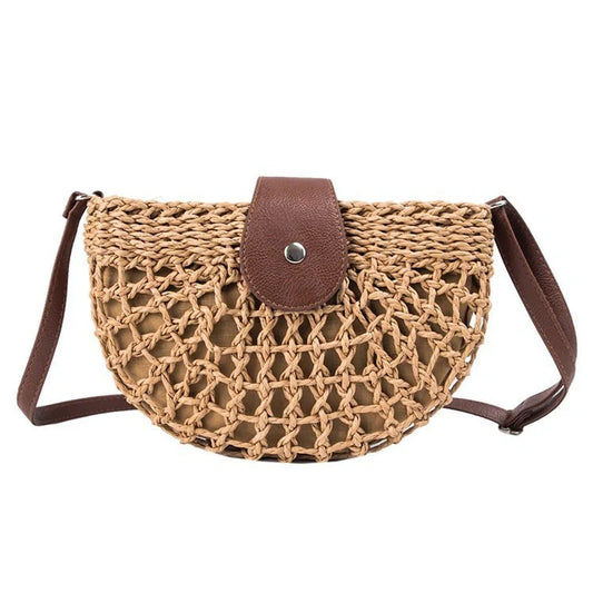 A stylish one-shoulder straw saddle bag with a zipper closure, perfect for modern British consumers.