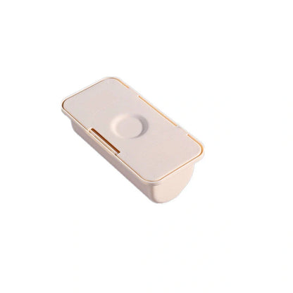 Wall-mounted plastic garbage bag holder in white, grey, or pink for kitchen organisation