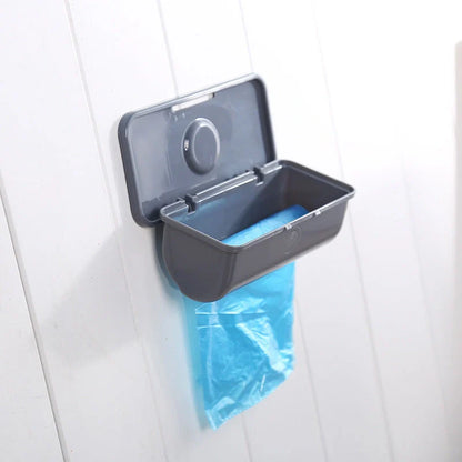 Wall-mounted plastic garbage bag holder in white, grey, or pink for kitchen organisation