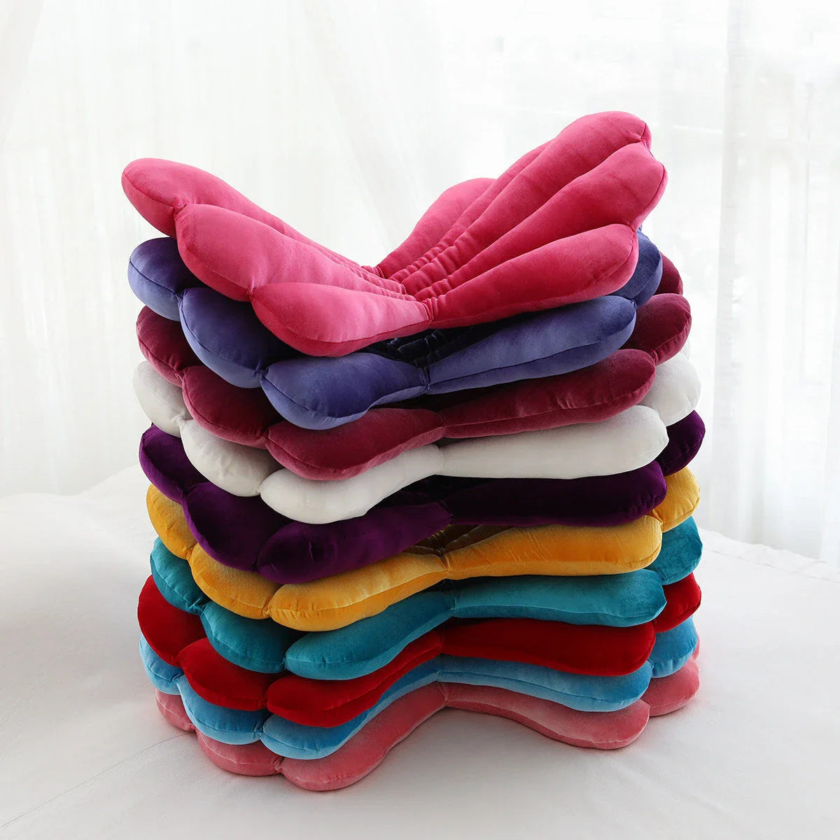 Luxurious velvet armchair cushion with unique rose seat design, available in various colours for comfortable relaxation in your living space.