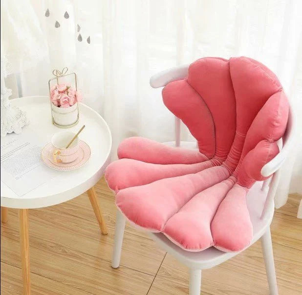 Luxurious velvet armchair cushion with unique rose seat design, available in various colours for comfortable relaxation in your living space.