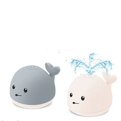 Adorable whale-shaped water sprinkler toy with LED lights and music for baby bath time entertainment