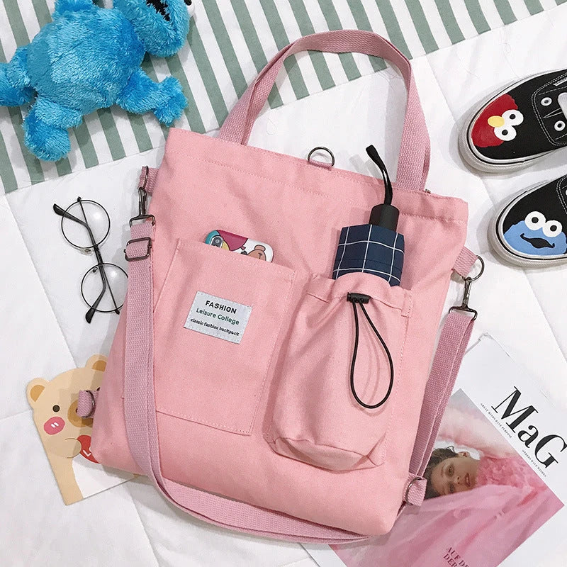 Stylish Harajuku-inspired canvas backpack with zipper closure, adjustable straps, and vibrant color options for students and women