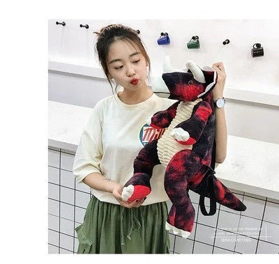 3D dinosaur plush backpack for children in blue, red, brown, and green