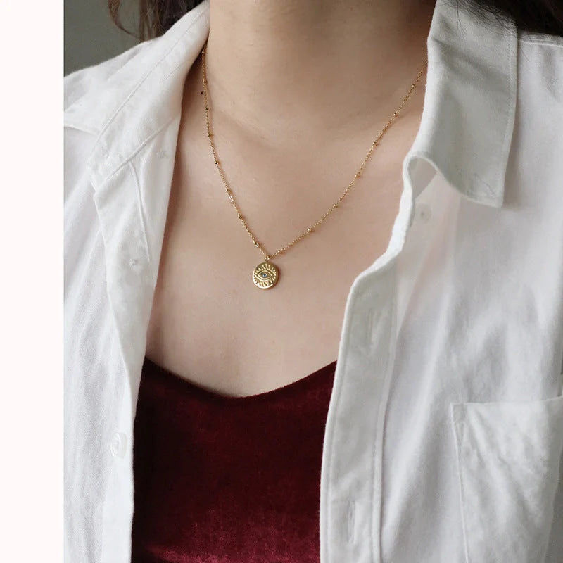 Stylish blue eye design titanium steel coin necklace for women