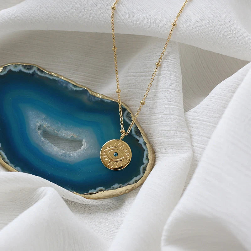 Stylish blue eye design titanium steel coin necklace for women
