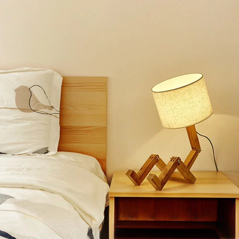 Robot-shaped LED table lamp with wooden base and linen shade for modern Nordic decor