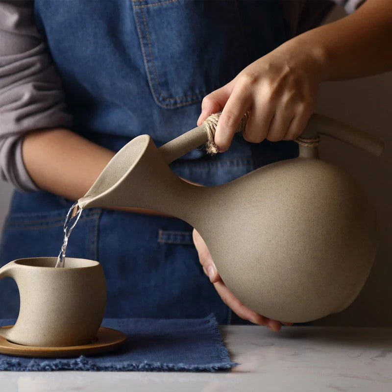 Premium ceramic cold brew teapot set with elegant floral design, including teapot, lid, and bamboo tray